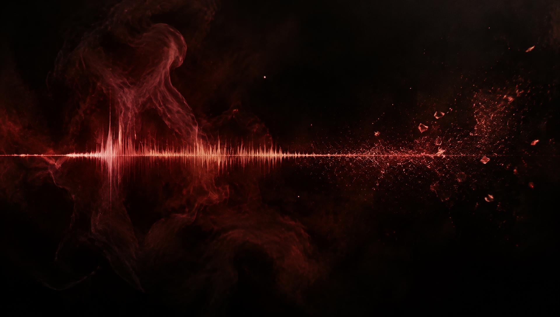 Abstract crimson sound wave dissolving into light particles against deep black